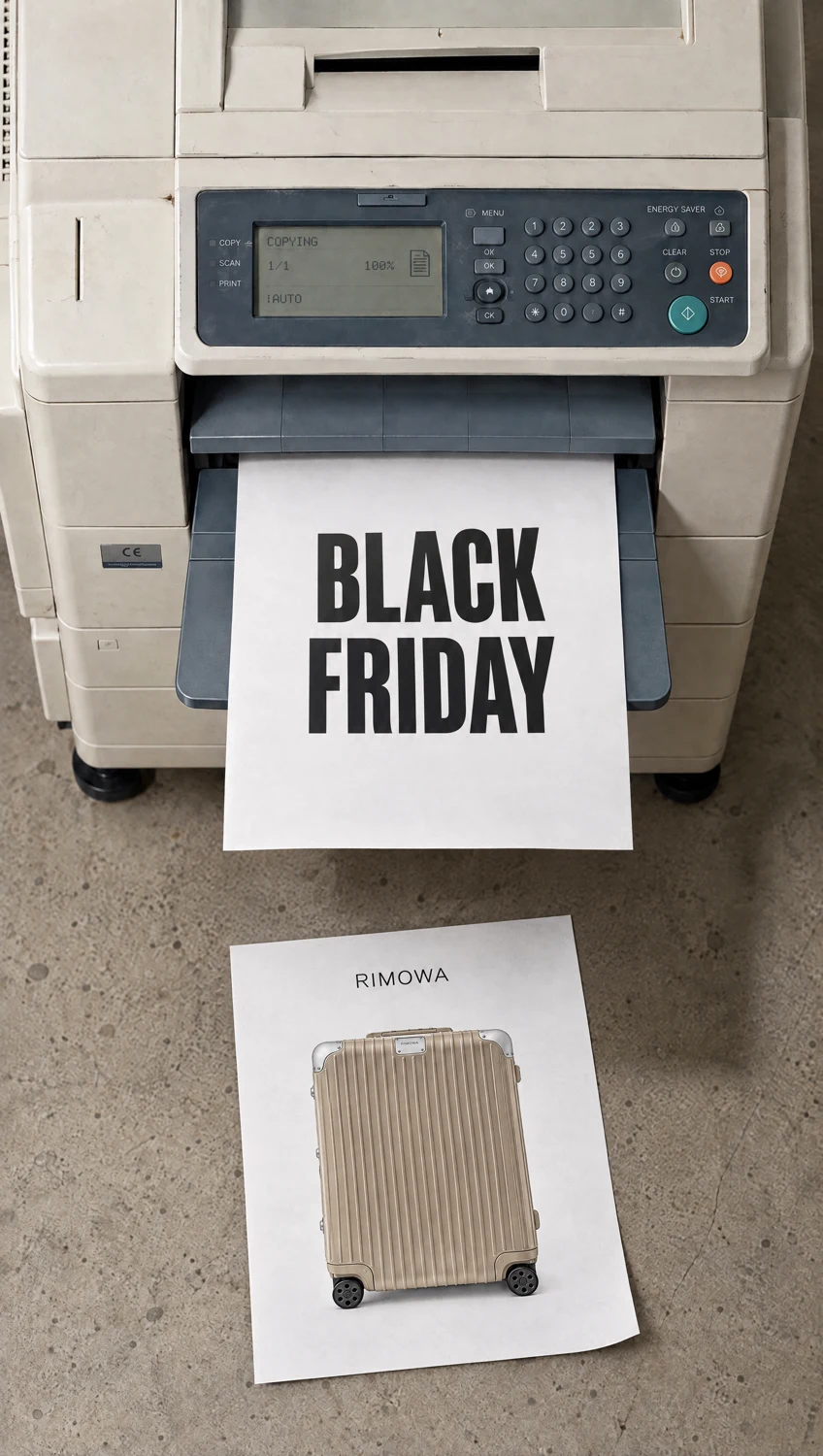 Black Friday paper emerging from the printer above the product sheet.