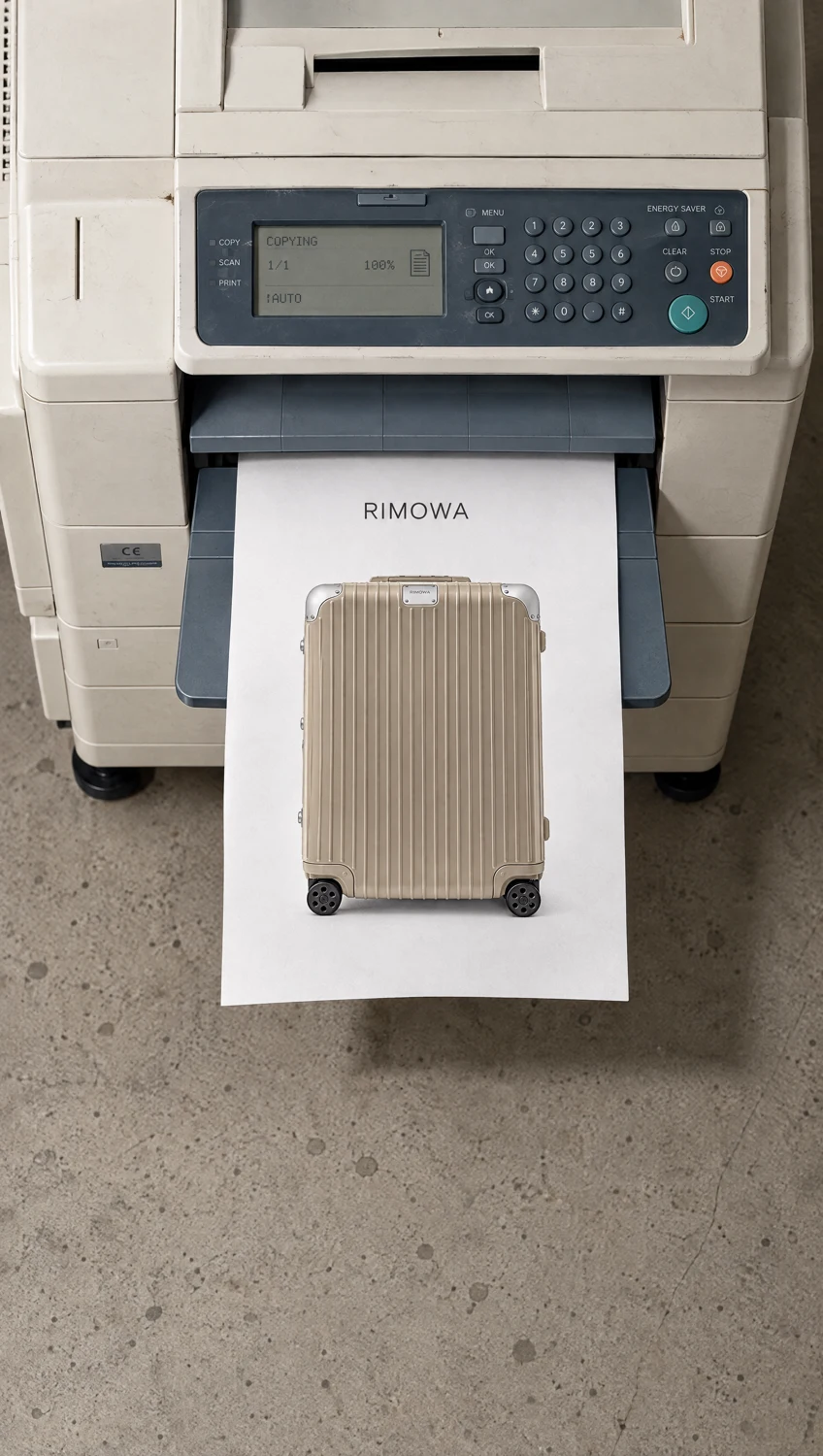 Vintage printer releasing a paper with the RIMOWA suitcase image.
