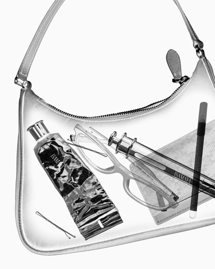 A monochrome translucent handbag revealing glasses, a tube, pencils and other personal items.