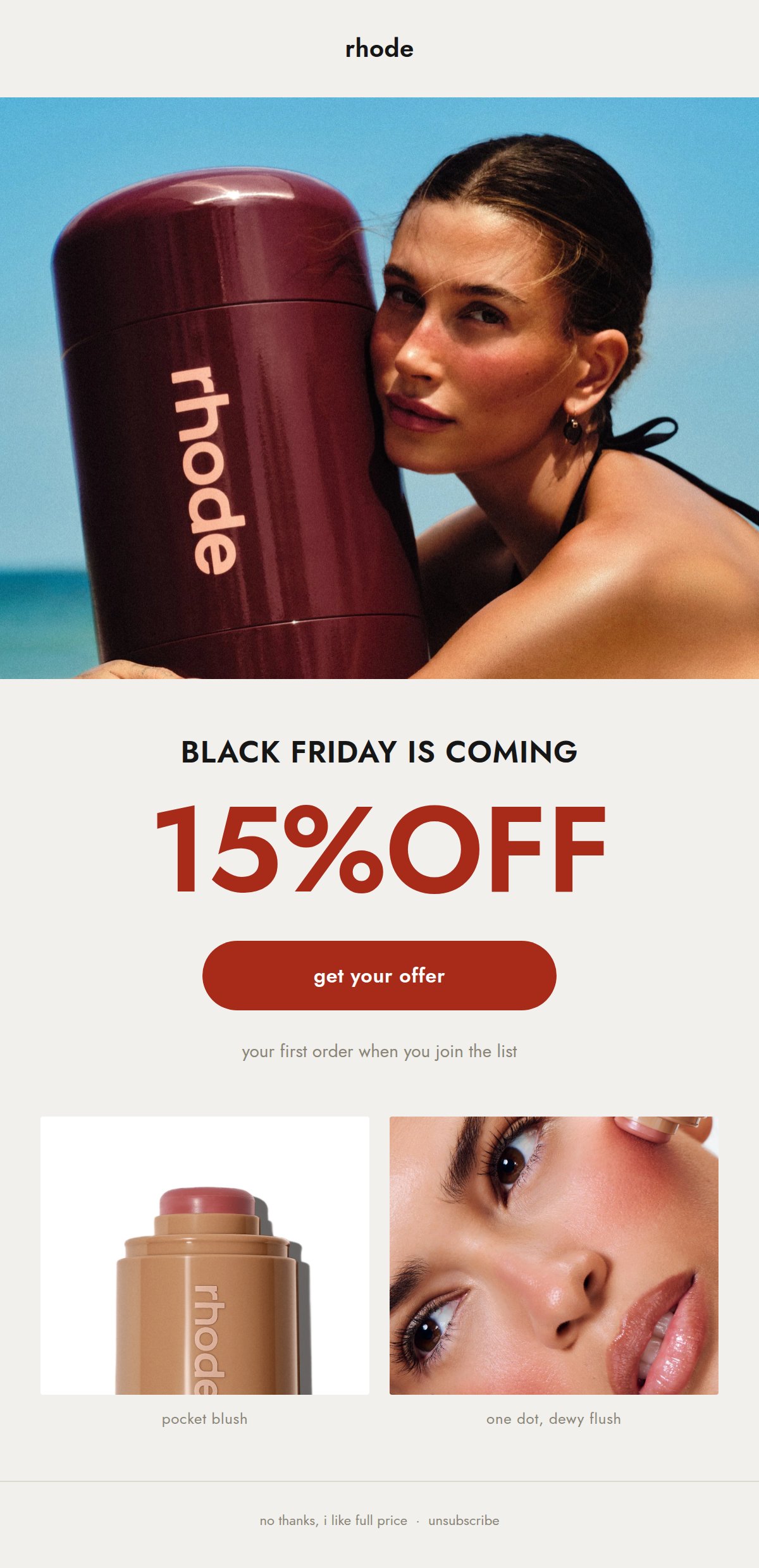Email hero image with the rhode wordmark, a full bleed editorial photo, the headline Black Friday is coming, 15 percent off in red, a get your offer button, and two product photos at the bottom of the email