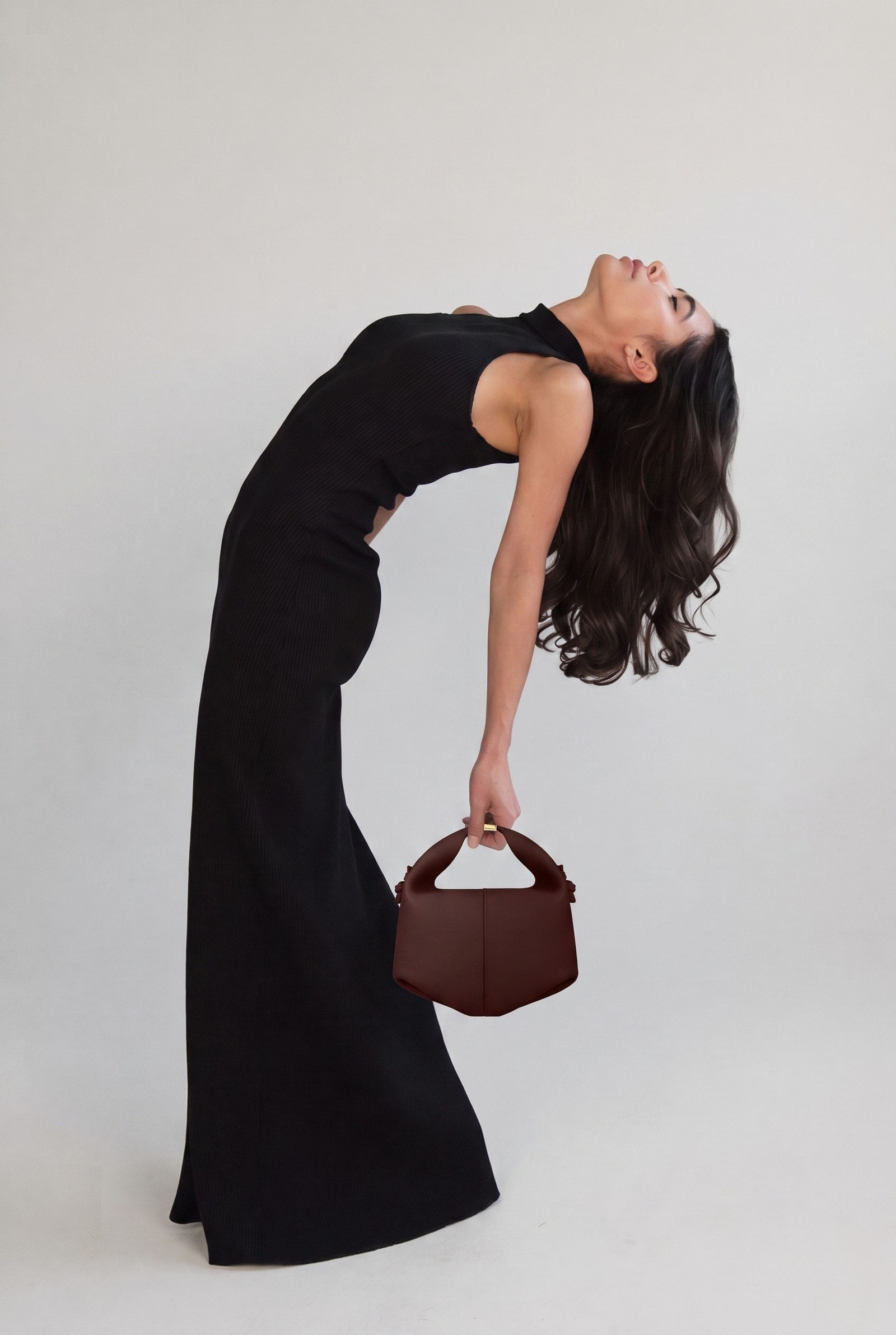 A fourth angle of the AI model with the real bag correctly composited, front view, mustard gloves, no visible skin
