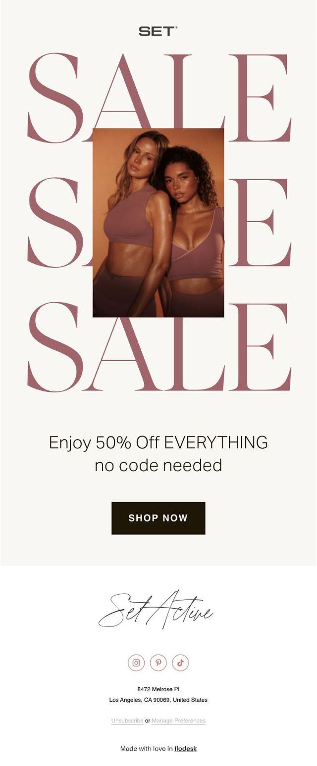 Email design with the word SALE set three times in large type behind a photo of two models in mauve activewear