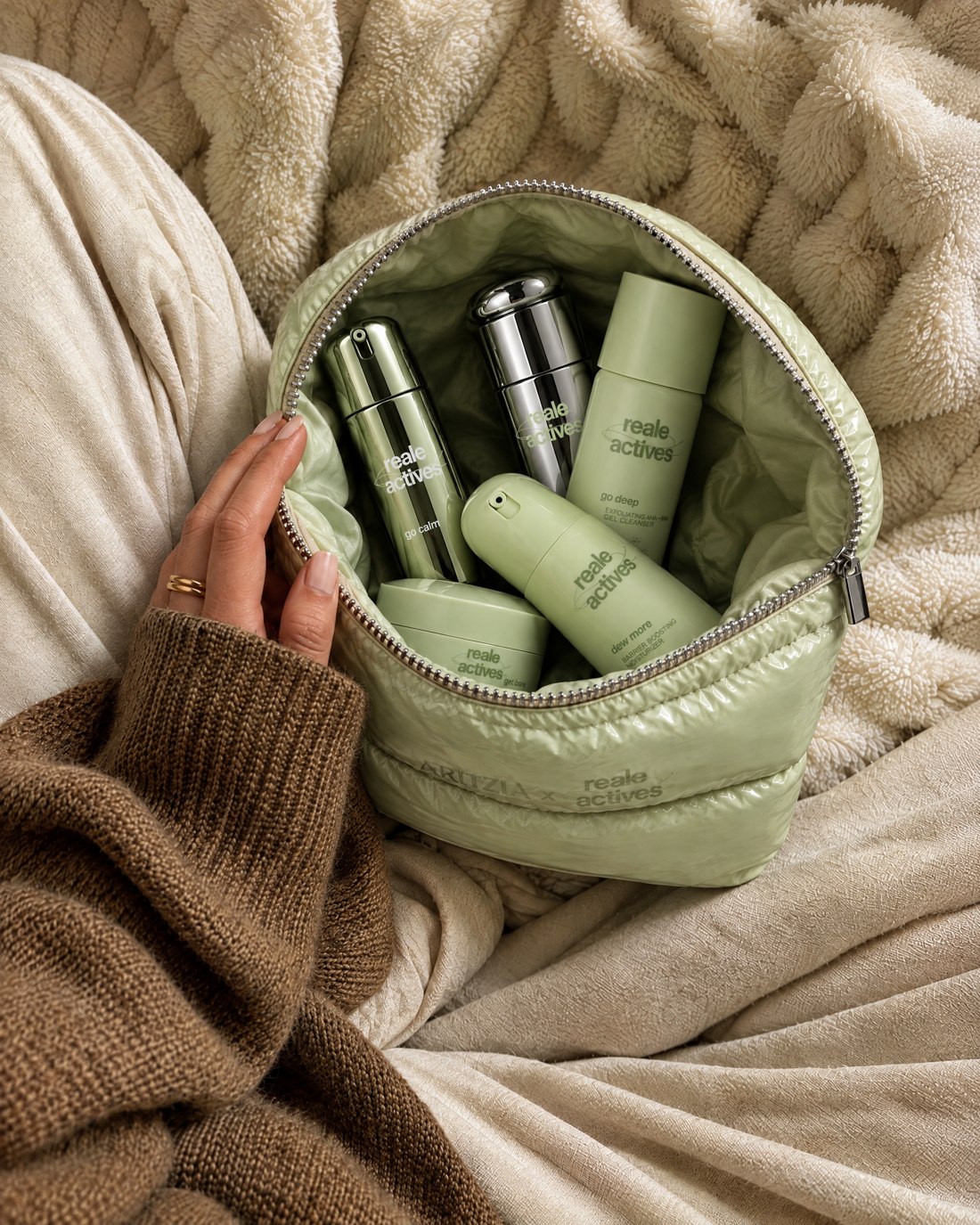 The pouch on a lap. Imaginary AI-generated Aritzia x Reale Actives campaign.