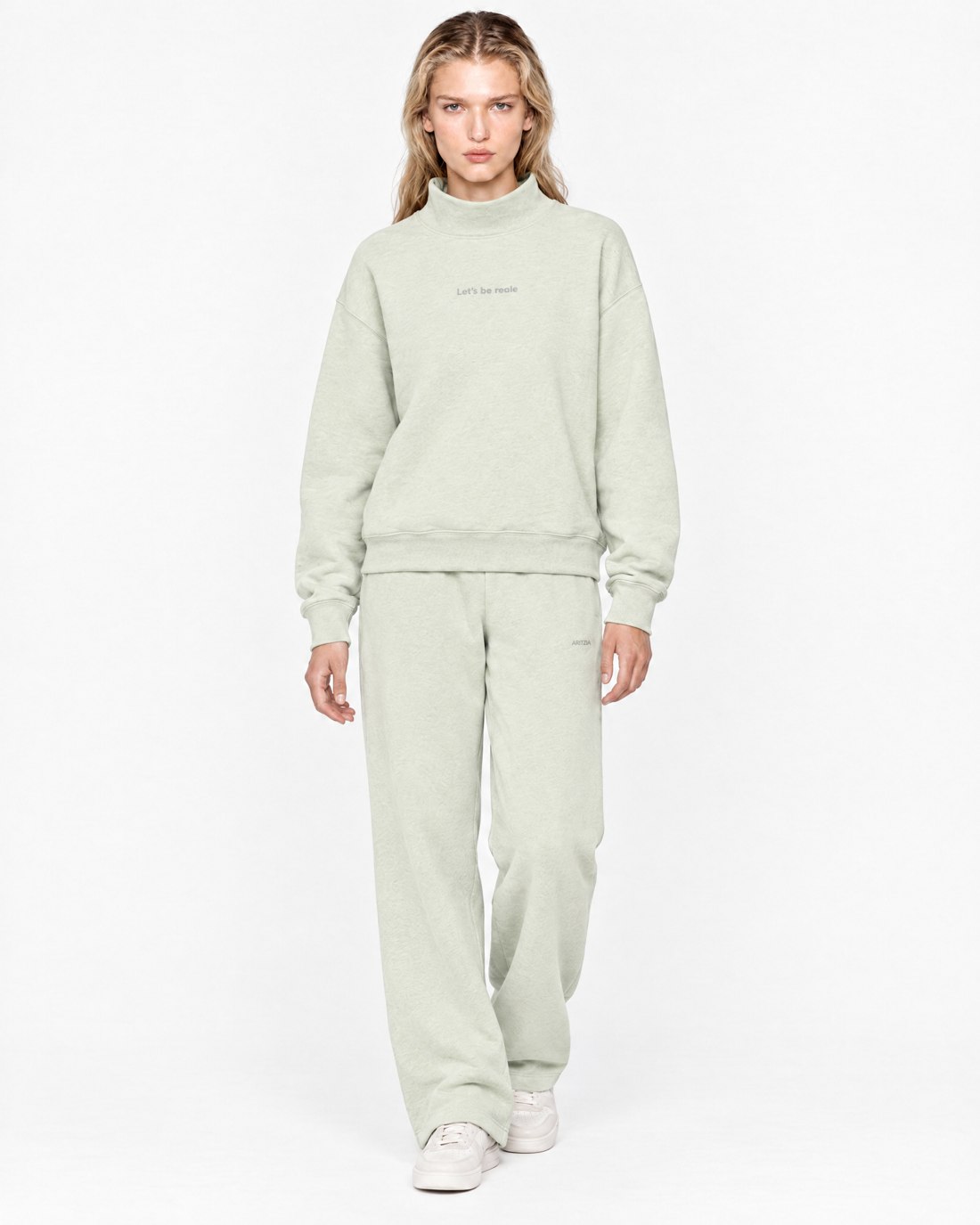 The funnel-neck set. Imaginary AI-generated Aritzia x Reale Actives campaign.