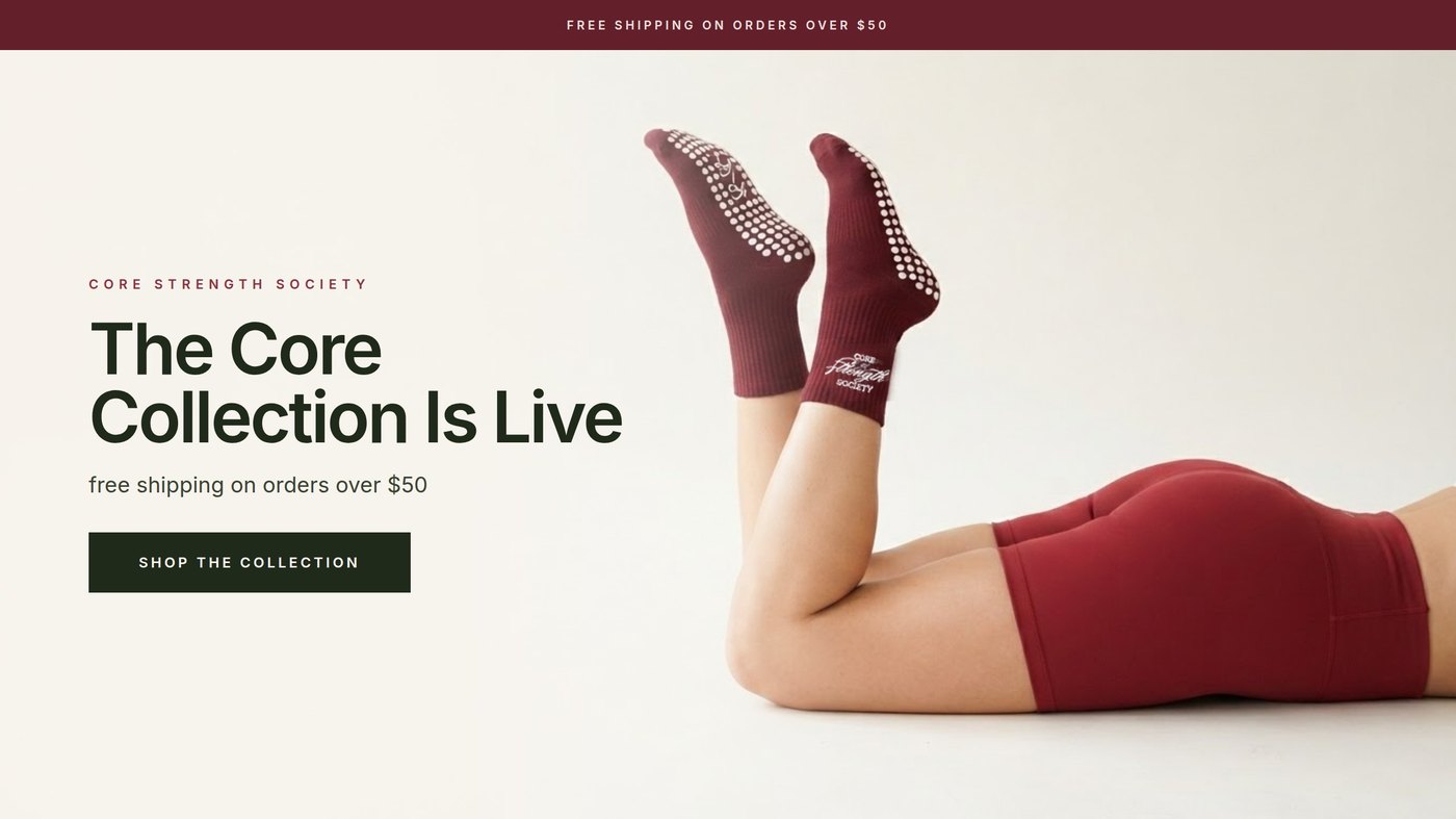 Finished campaign banner on ivory showing burgundy grip socks worn by a woman lying on a studio floor with her feet raised, headline reading The Core Collection Is Live